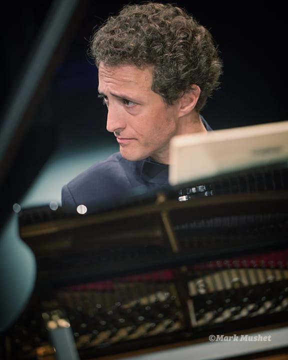 Omri Epstein playing piano with the Busch Trio