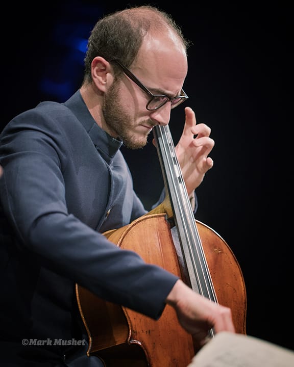 Ori Epstein playing cello with the Busch Trio
